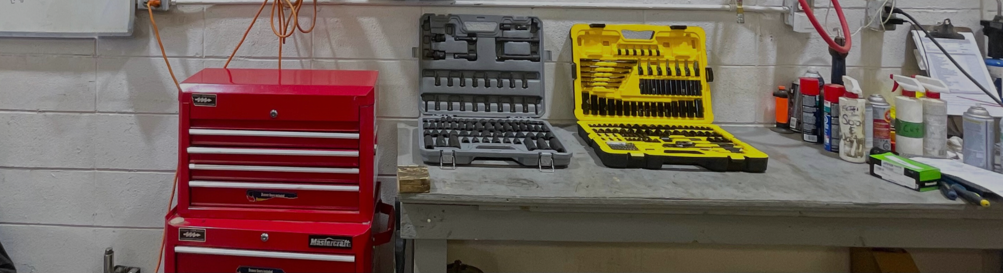 A view from inside the service shop. Various shop tools are laid on a table.